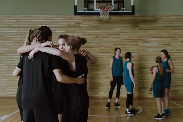 young basketball team huddle